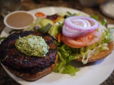 The Cupping Room — A veggie burger with salad on a plate