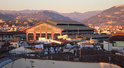 Mercato Centrale — The market hall seen above Florence rooftops at sunset