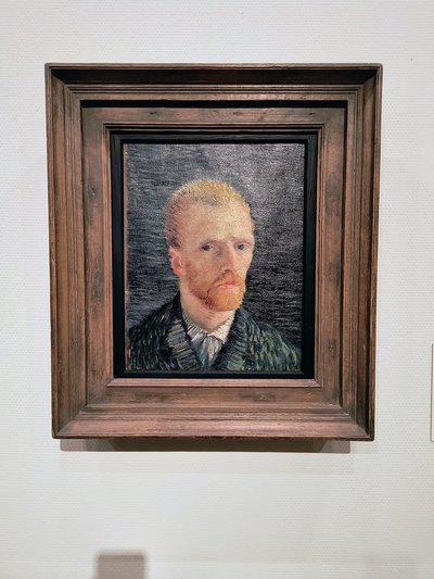 Van Gogh Museum — Self-portrait in a wooden frame against a dark ground