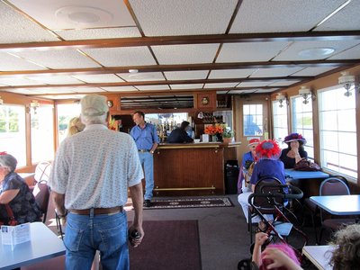 The Prairie Lily — Inside the boat’s passenger room, with tables and a service counter