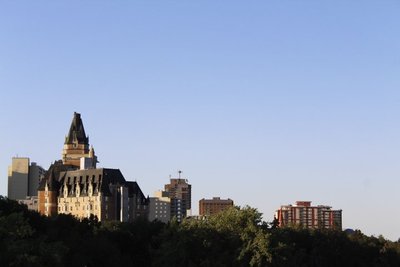 Delta Hotels Bessborough — The Bessborough rising above trees and nearby buildings